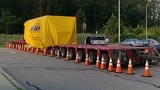 Truck hauling giant generator moved to Park & Ride lot