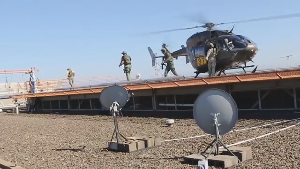 Helicopter lands atop Portland highrise as part of police, military