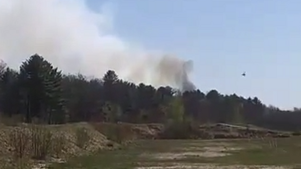 Woods fire closes major road in Turner WGME