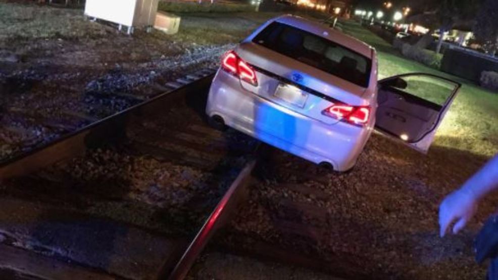 Off-duty Police Officer Rescues Driver Stuck On Railroad Tracks | WTVX